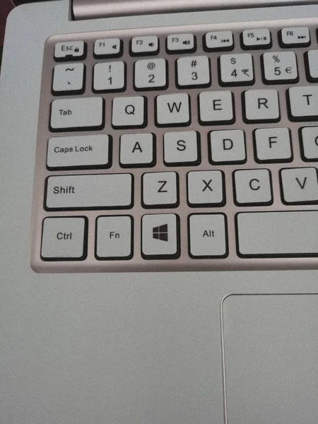 close up of a computer keyboard with a white background