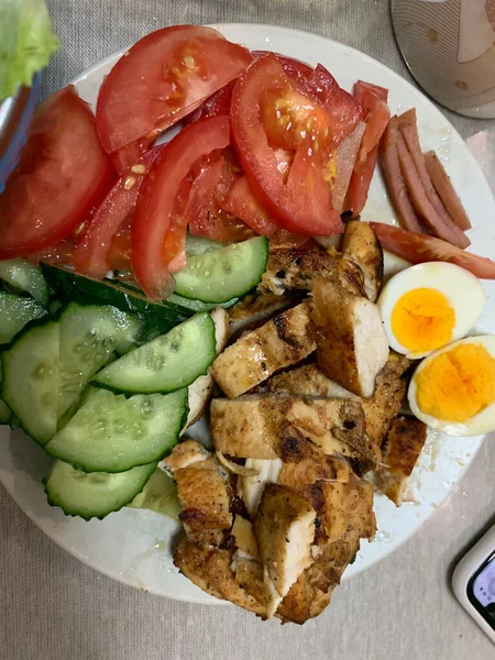 breakfast with bacon, eggs, tomato, cucumber, lettuce, onion, cheese, tomatoes, cucumbers,