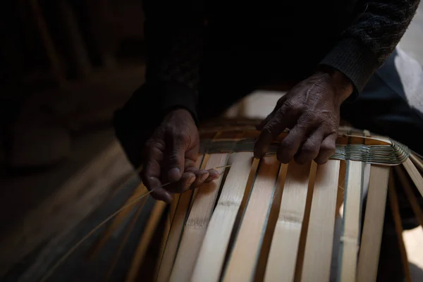 man playing piano with a wooden band