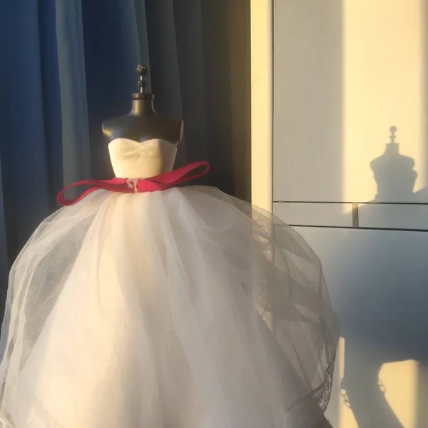 wedding dress on mannequin in the room