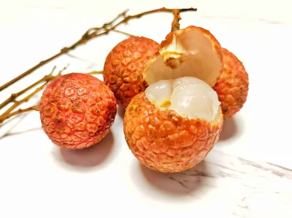 fresh ripe red and white fruits on a wooden background