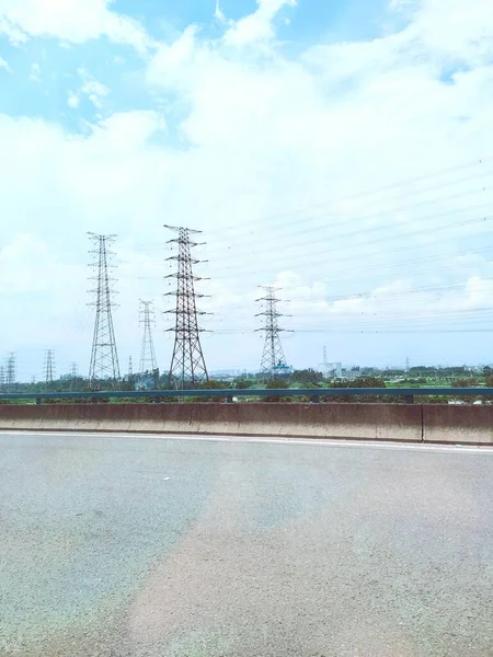 high voltage power line with blue sky