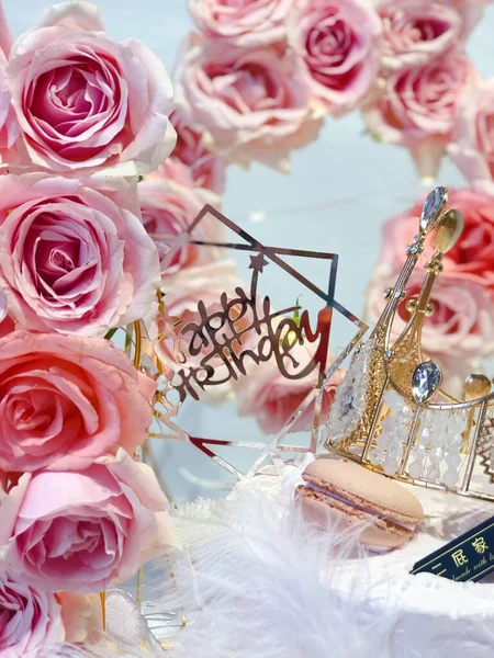 beautiful wedding rings on a background of roses