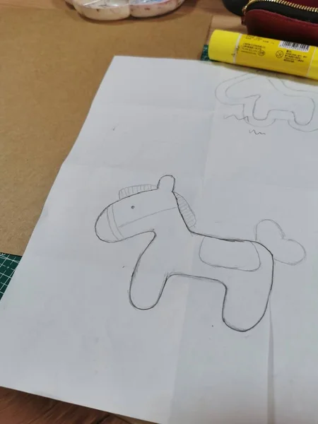 handmade paper craft with a toy on a sheet of a cardboard