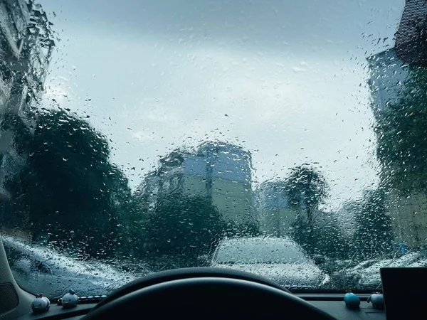 car wash window with rain drops on the glass