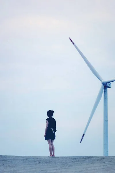 wind turbine with windmill on the background of the sea