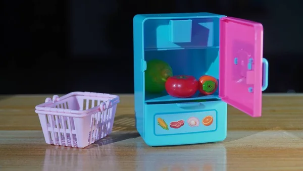 toy game with dice and a red apple on a blue background