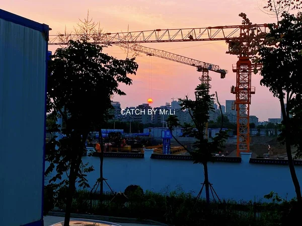 construction site with cranes and building
