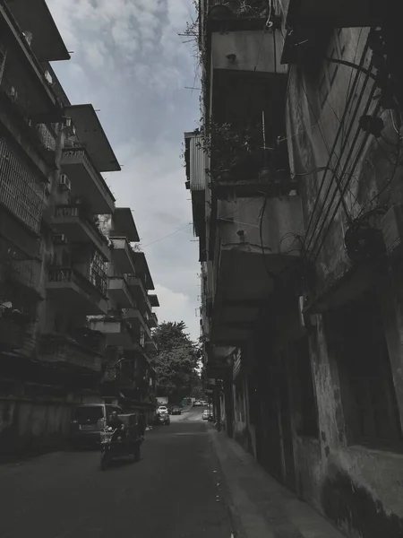 old street in the city of the most polluted building in the background