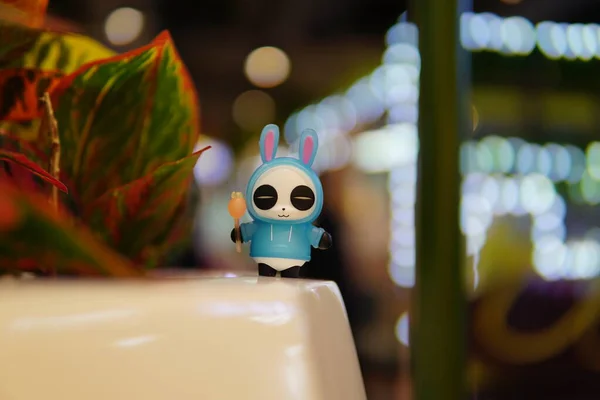a closeup shot of a cute robot on a wooden table