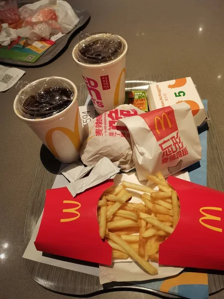 fast food, junk eating, unhealthy and people concept-close up of delicious fries and cola