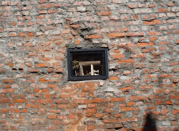 old brick wall with a window