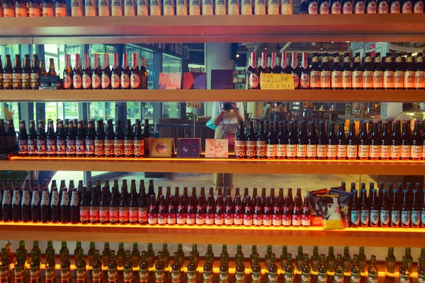 different types of wine bottles in a row