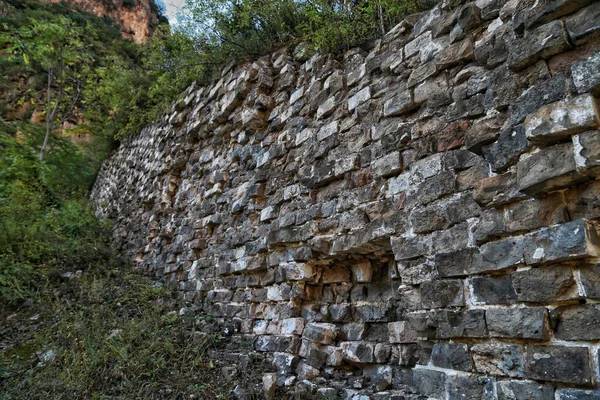 old stone wall with a large pattern of the ancient brick walls