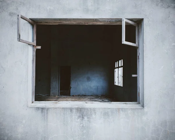 old wooden window with a white wall