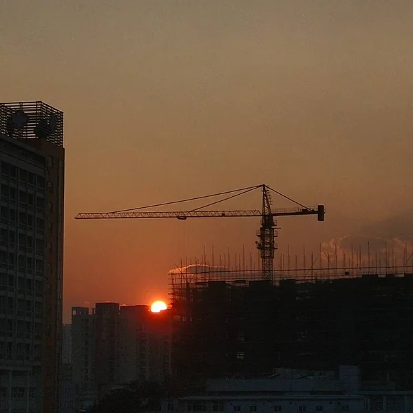 construction cranes and building on the background of the city