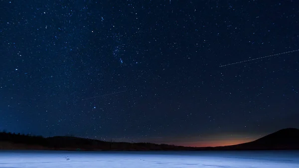 night sky with stars and snow