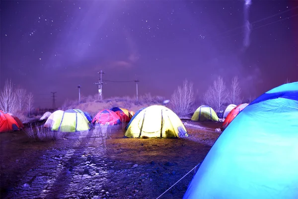 camping tent with tents and campfire in the night sky