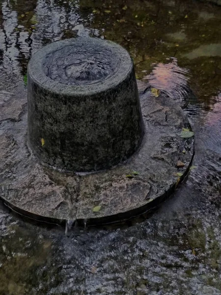 old stone wall with water drops