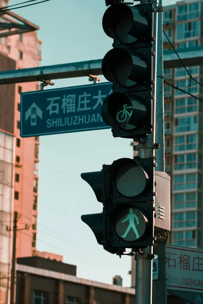 street traffic light with green lights