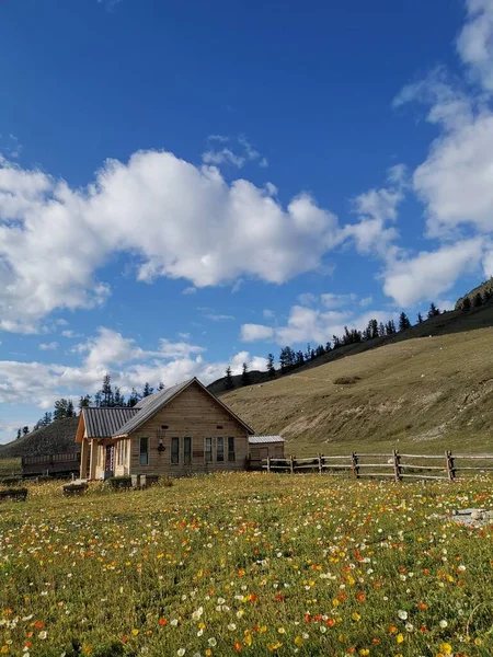 beautiful landscape with a wooden house in the mountains