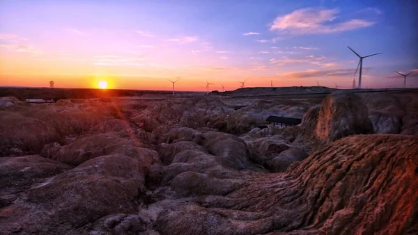 wind turbines in the sunset