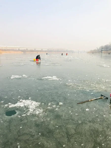ice fishing on the lake