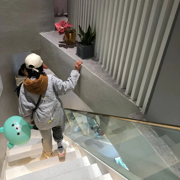 man in a mask and a protective masks on the roof of the building