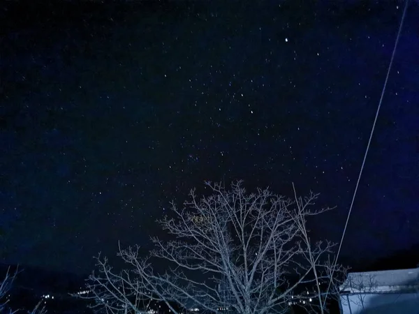 night sky with stars and snow