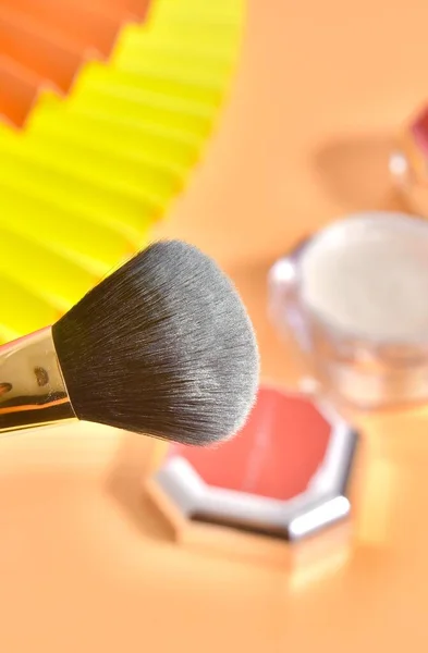makeup brushes and brush on a white background
