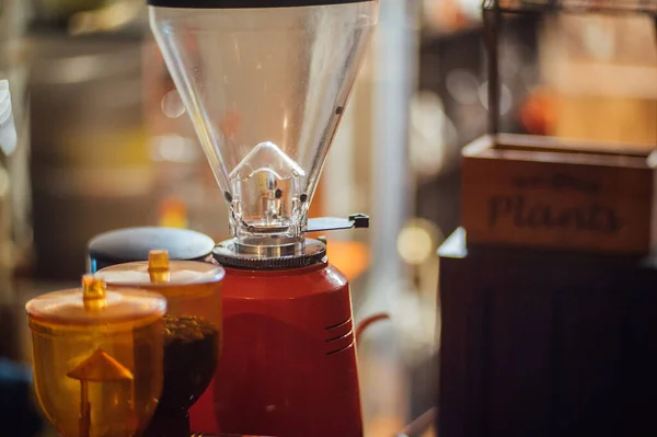 a closeup shot of a glass of coffee maker with a blurred background