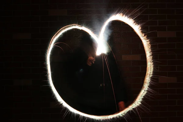 neon glowing heart on a black background