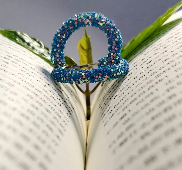 close up of a bible with a flower
