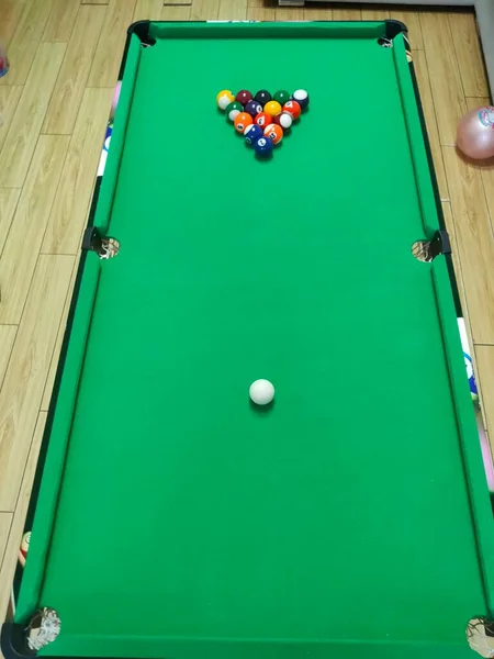billiard pool with green grass and cue