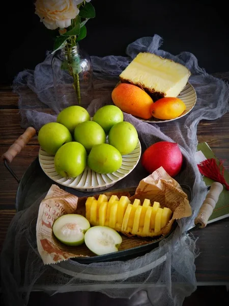 fresh fruits and vegetables on a black background