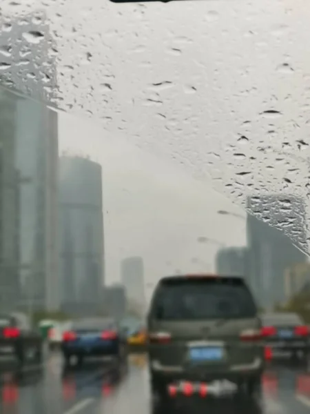 rainy weather, rain drops on the road