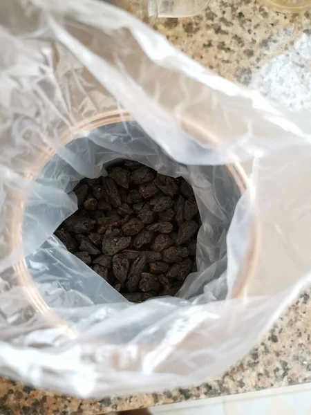 coffee beans in a bag on a white background