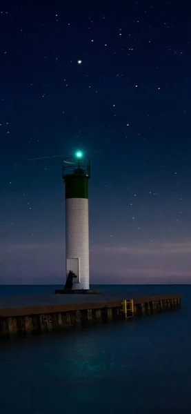 lighthouse at night, view from the window