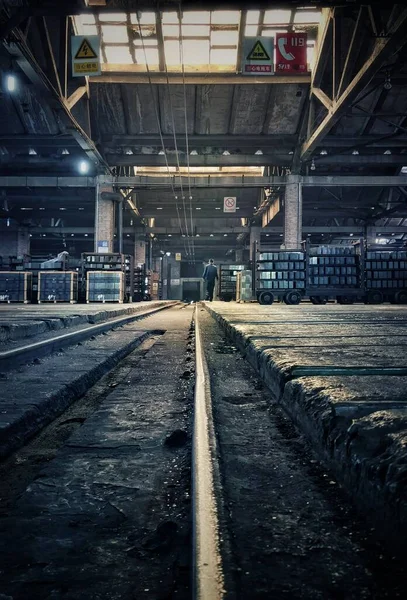 industrial factory, concrete floor, abandoned warehouse, underground, railway, rails, train, railroad, transport