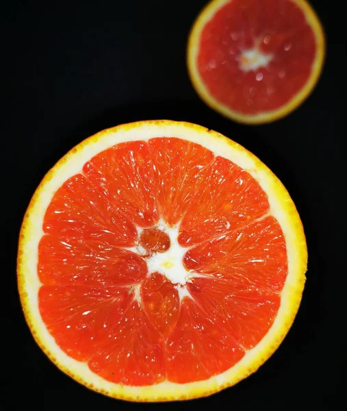 fresh orange slices on a black background