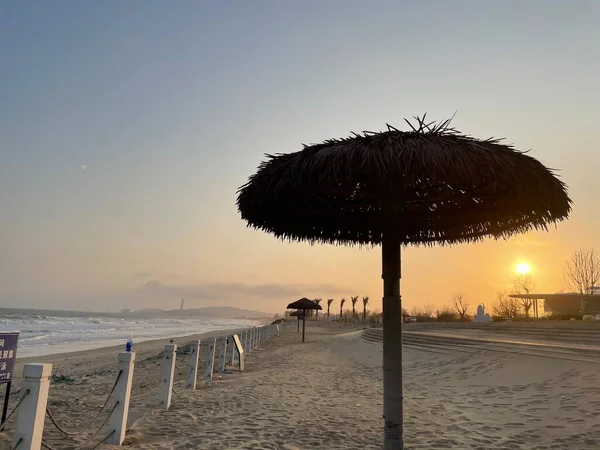 beautiful beach with umbrellas and umbrella on the sea