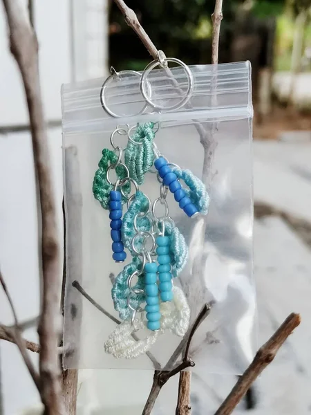 beautiful handmade decorative beads hanging on a rope