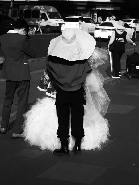 black and white photo of a couple in a wedding dress
