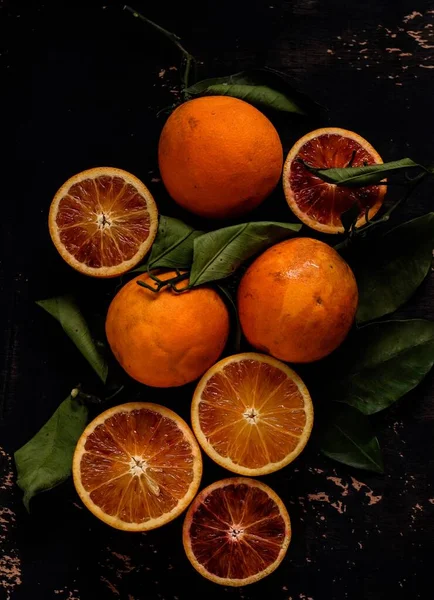 fresh orange and green leaves on a black background