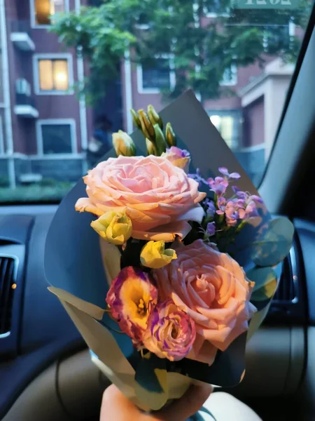 beautiful wedding bouquet of roses in the car