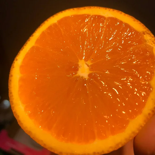 orange slice of fresh juicy oranges on a black background