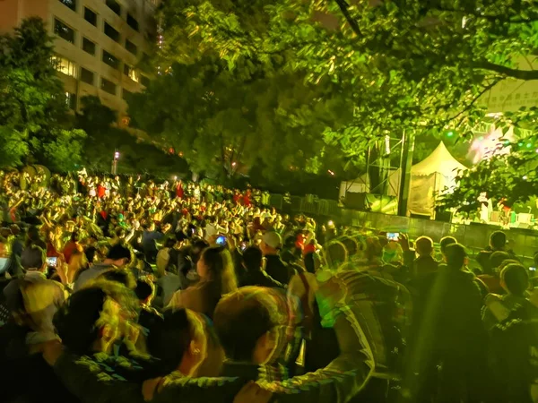 crowd of people in the park