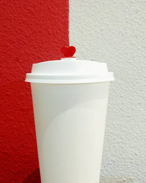 disposable cup of coffee on a white background