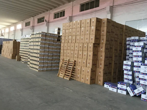 warehouse, storage and distribution industry concept-stacked boxes of pallets and other materials