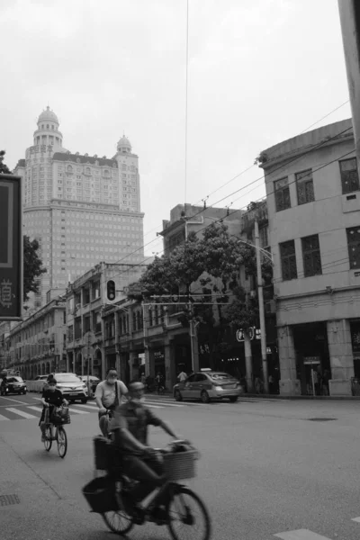 black and white photo of a street in the city